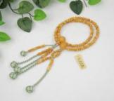 日蓮宗 本式数珠　つげ/拓植 (素挽)　8寸 (平玉)　小田巻梵天房 (房色:青磁ふちどり) 京念珠